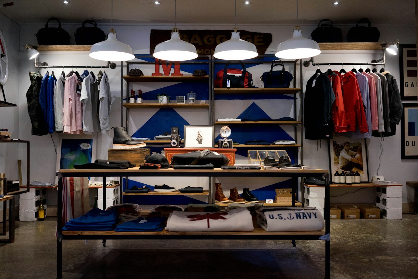 A clothing shop floor with racks of product.