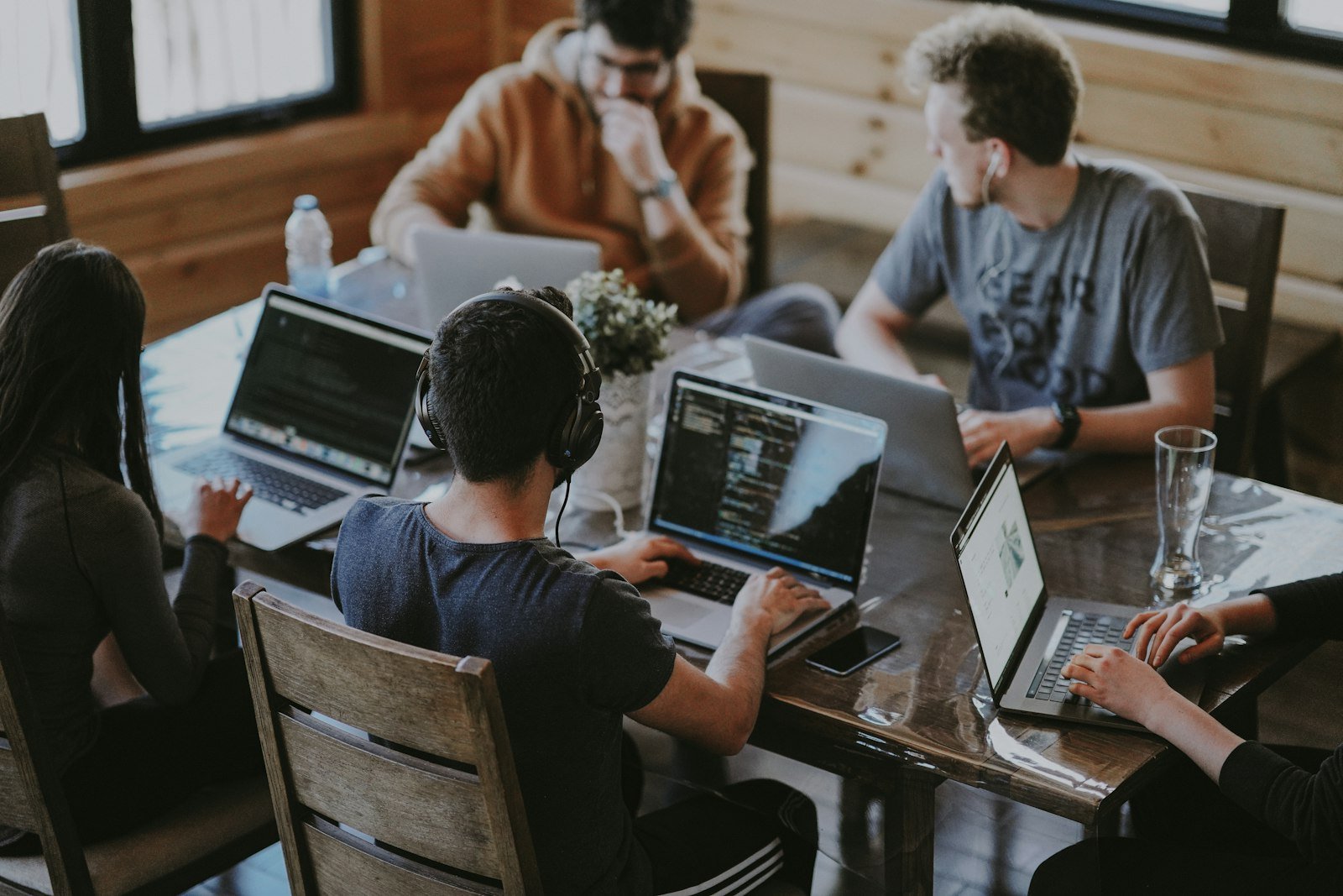 A team around a table, the kind of queue a monthly block covers.