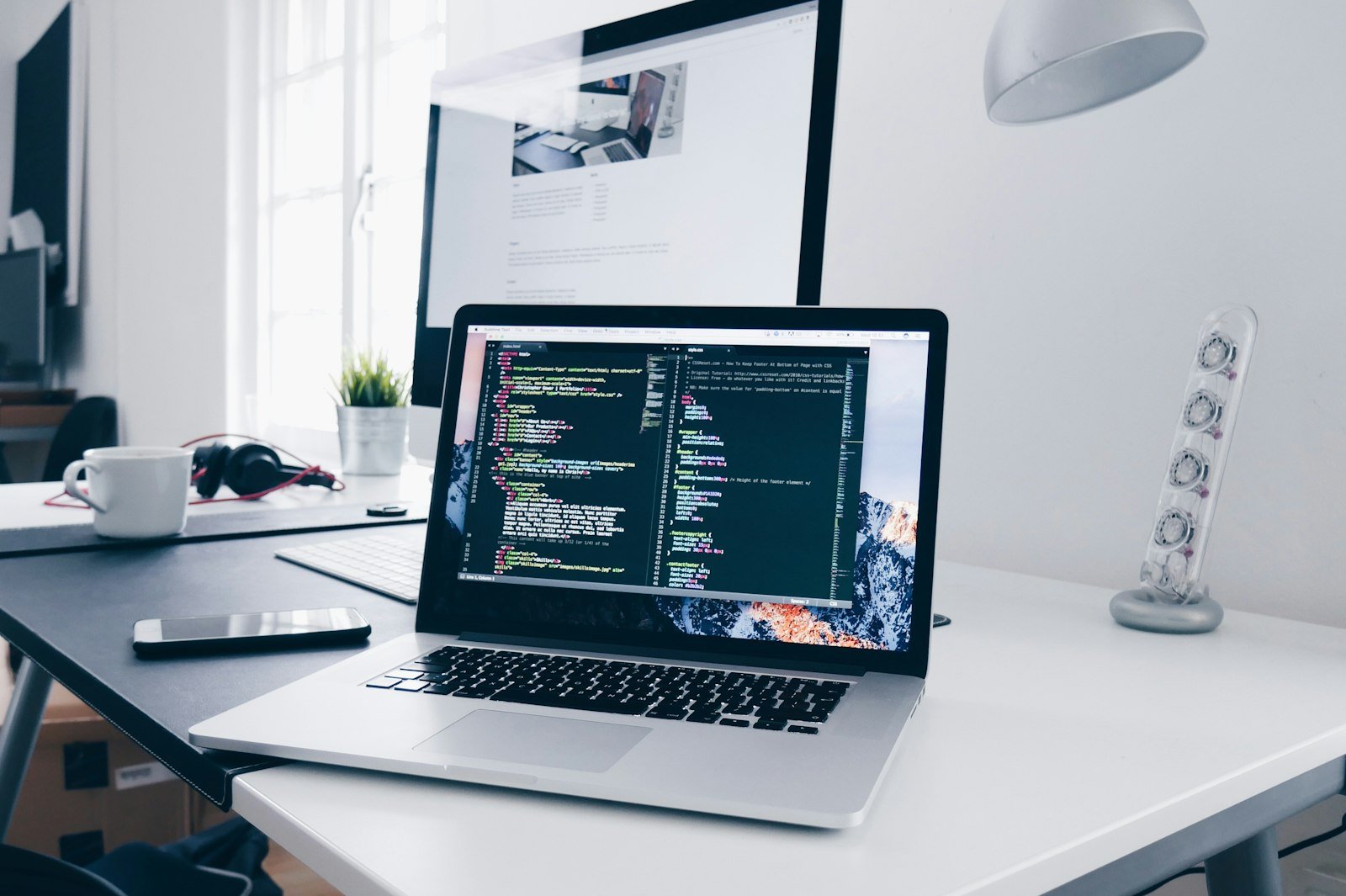 Code open on a laptop, the start of a custom software build.
