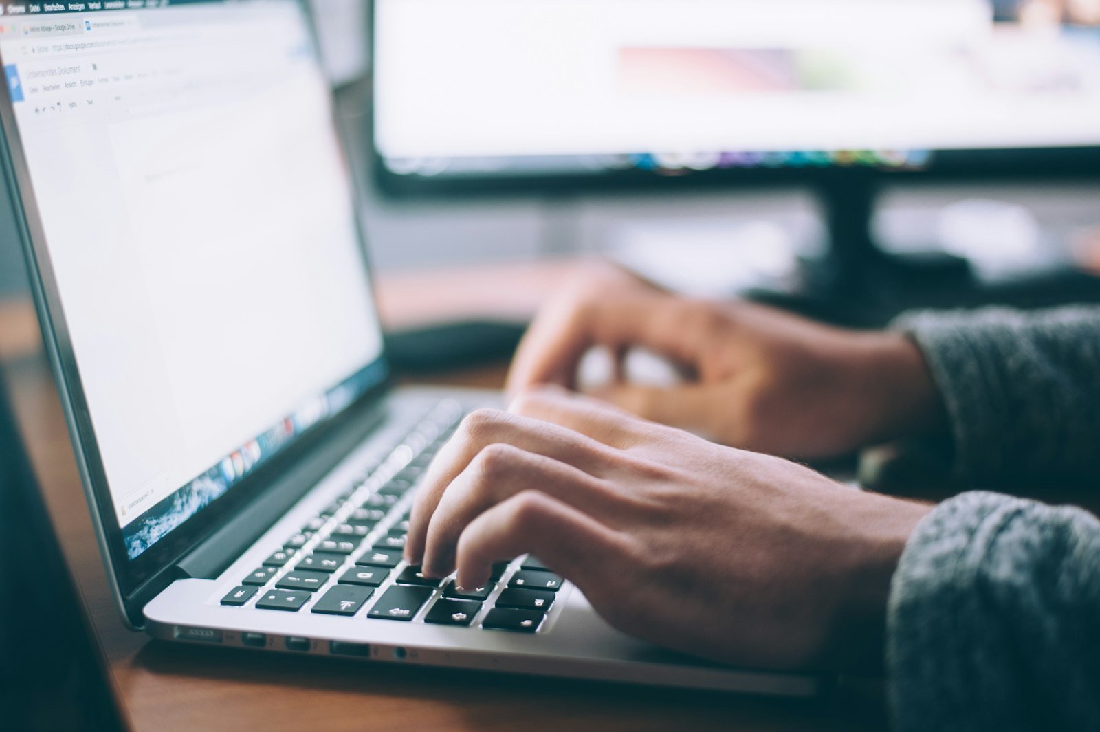 Hands on a laptop, the small break a support month is for.